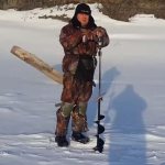 fisherman with ice auger